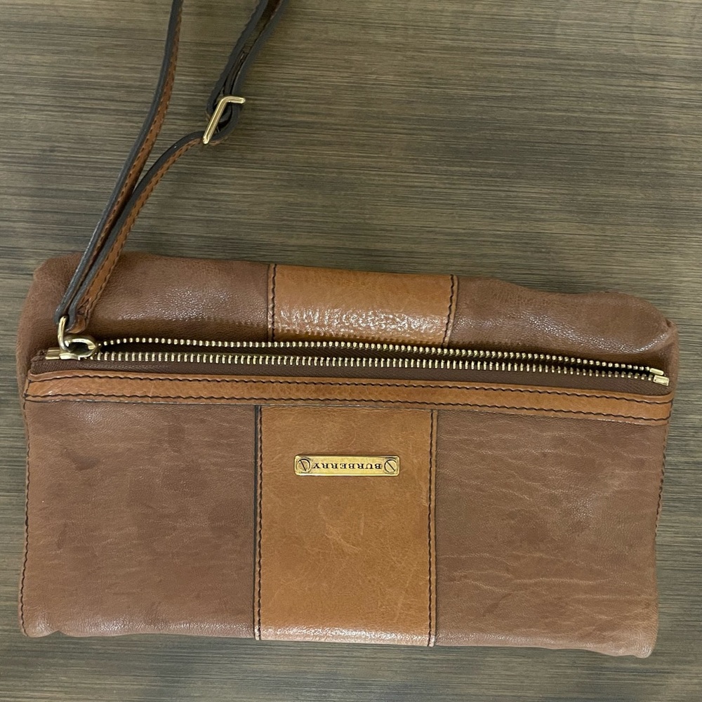Authentic Burberry wrist clutch.  Original dust bag.  Well taken care of.